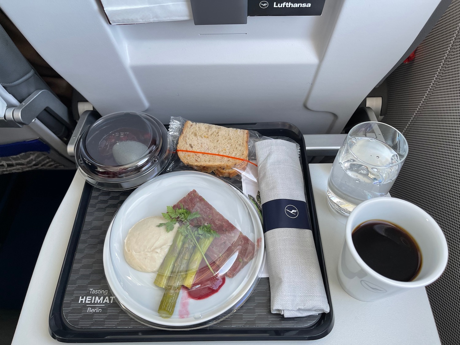 a tray with food and a cup of coffee on it