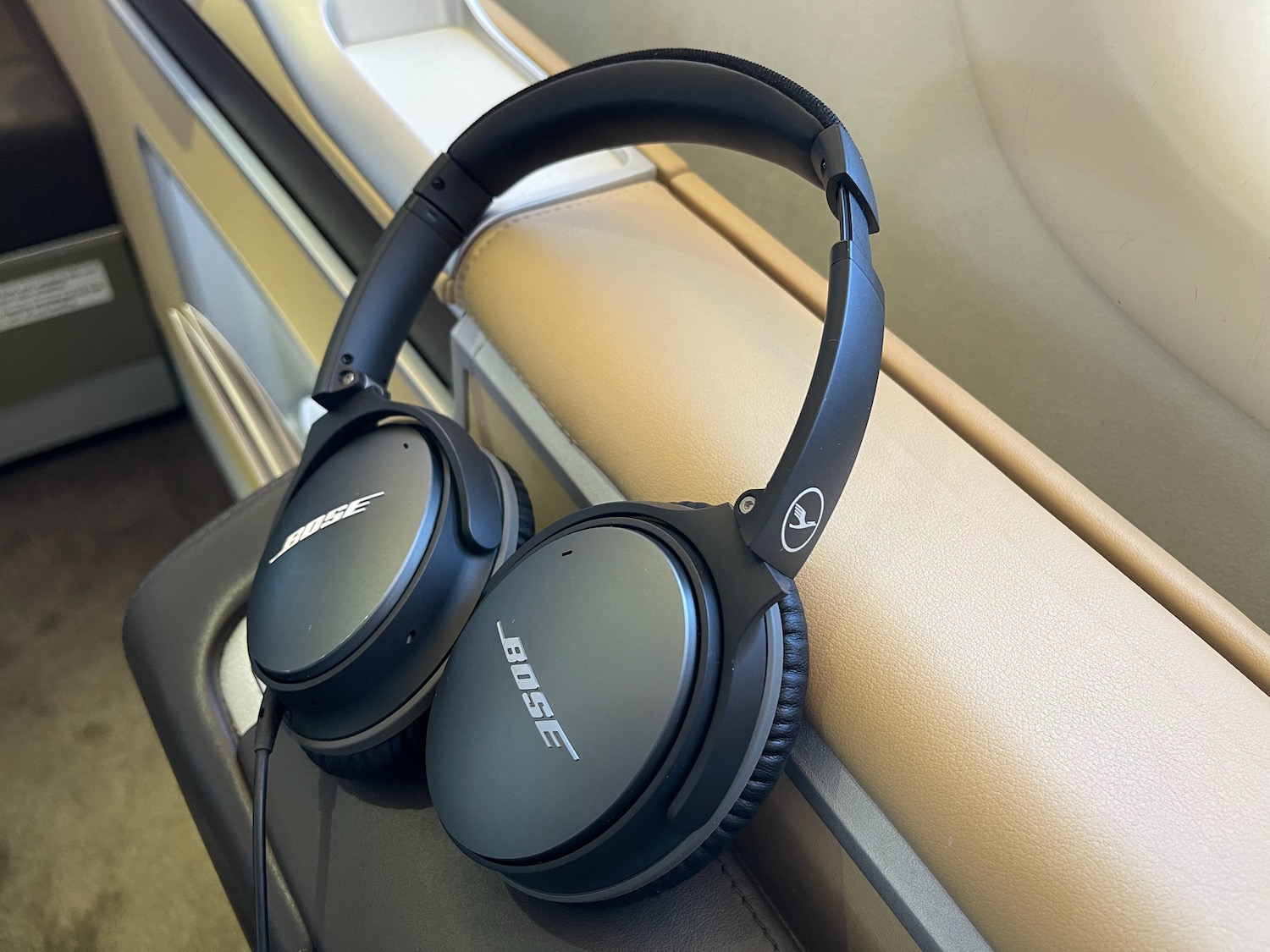 a pair of black headphones on a seat
