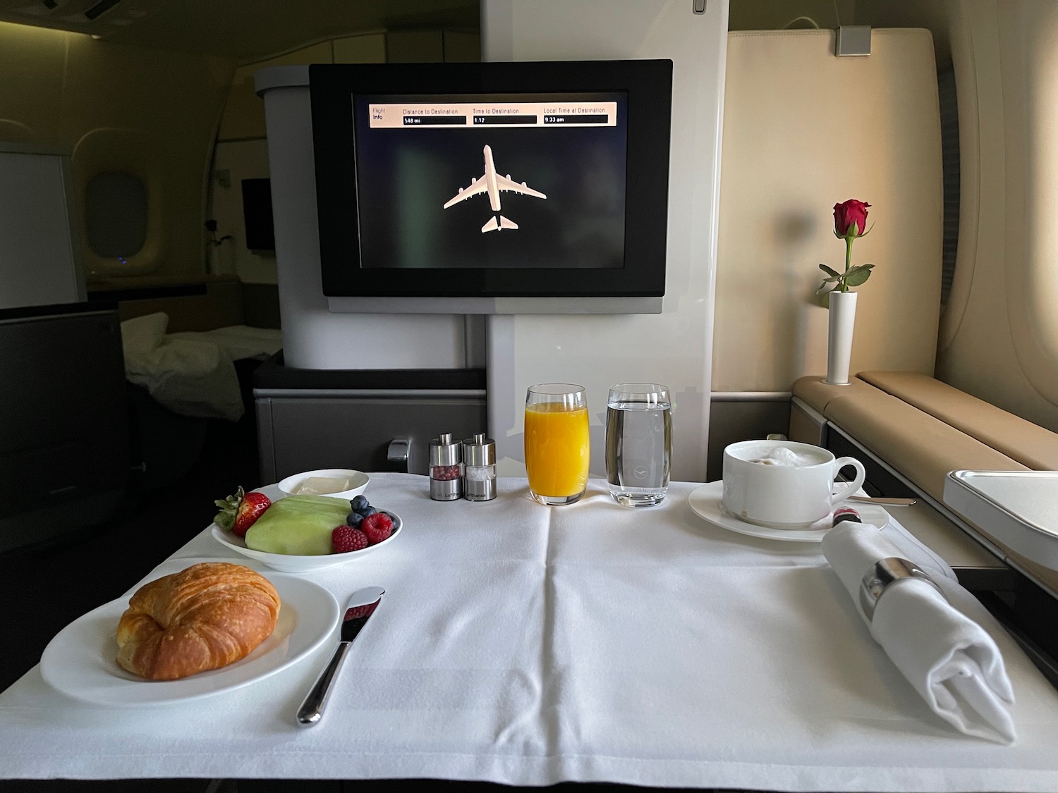 a table with food on it and a television on the wall