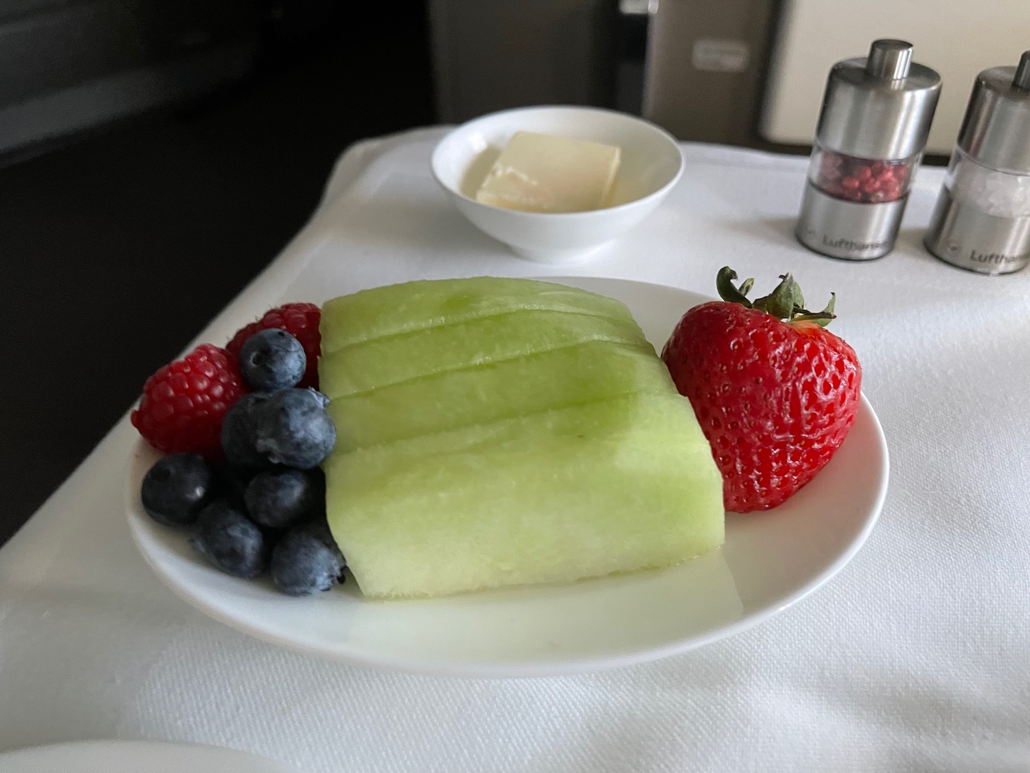 a plate of fruit and butter