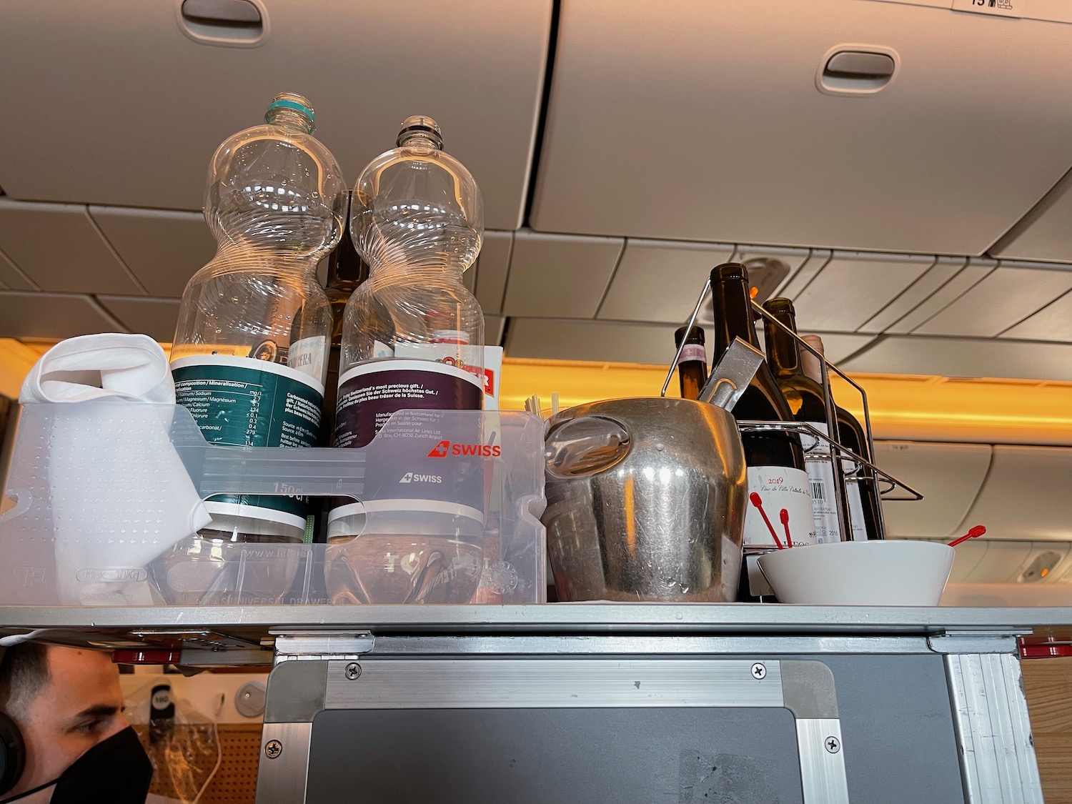 a group of bottles and a pitcher on a table