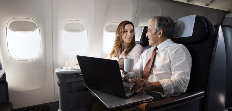 a man and woman on an airplane