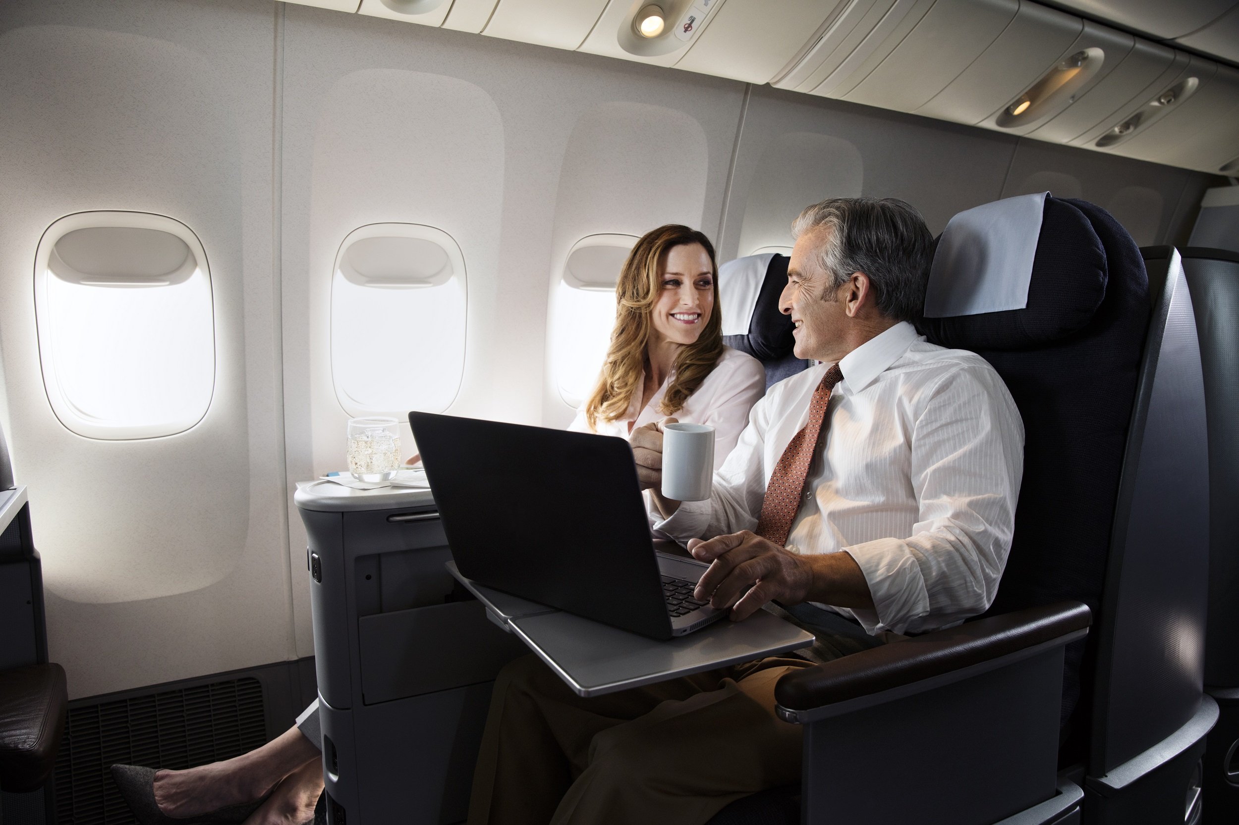 a man and woman on an airplane