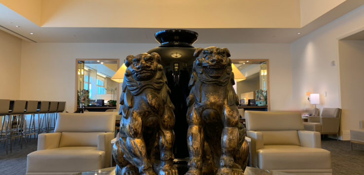 a statue of two lions in a lobby