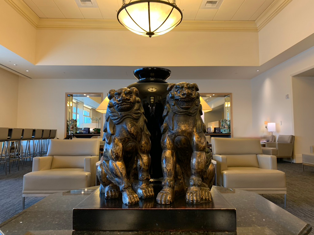 a statue of two lions in a lobby