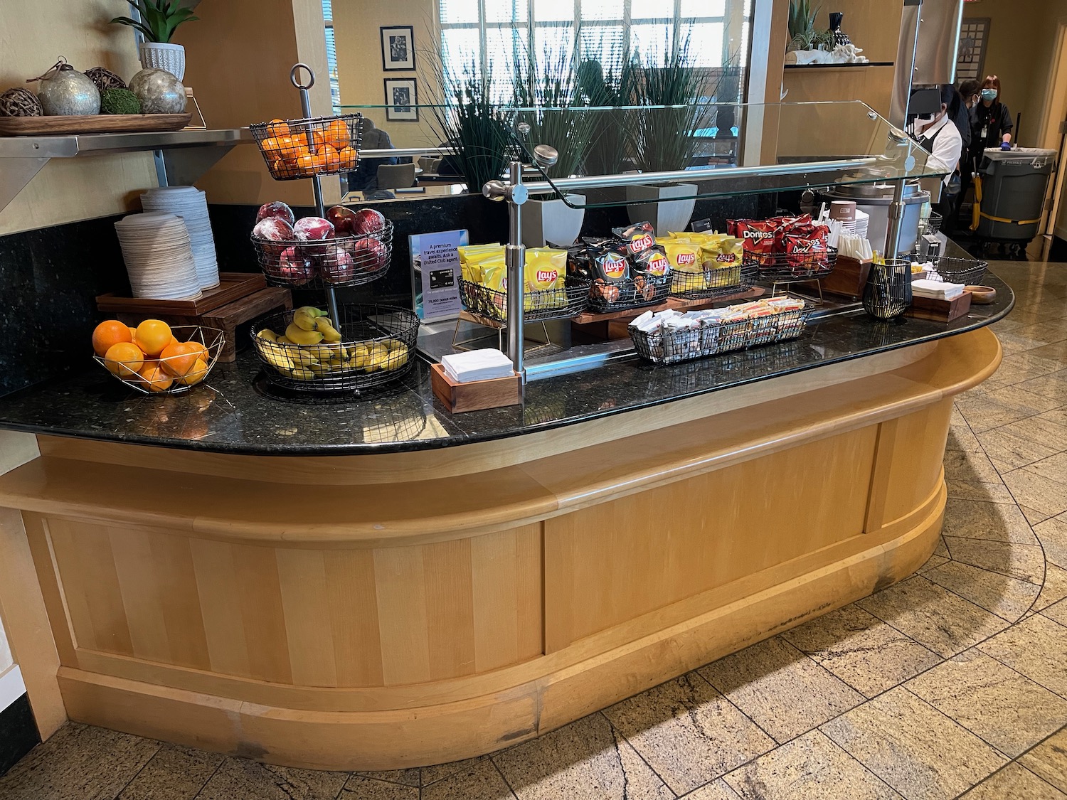 a counter with fruit and snacks on it