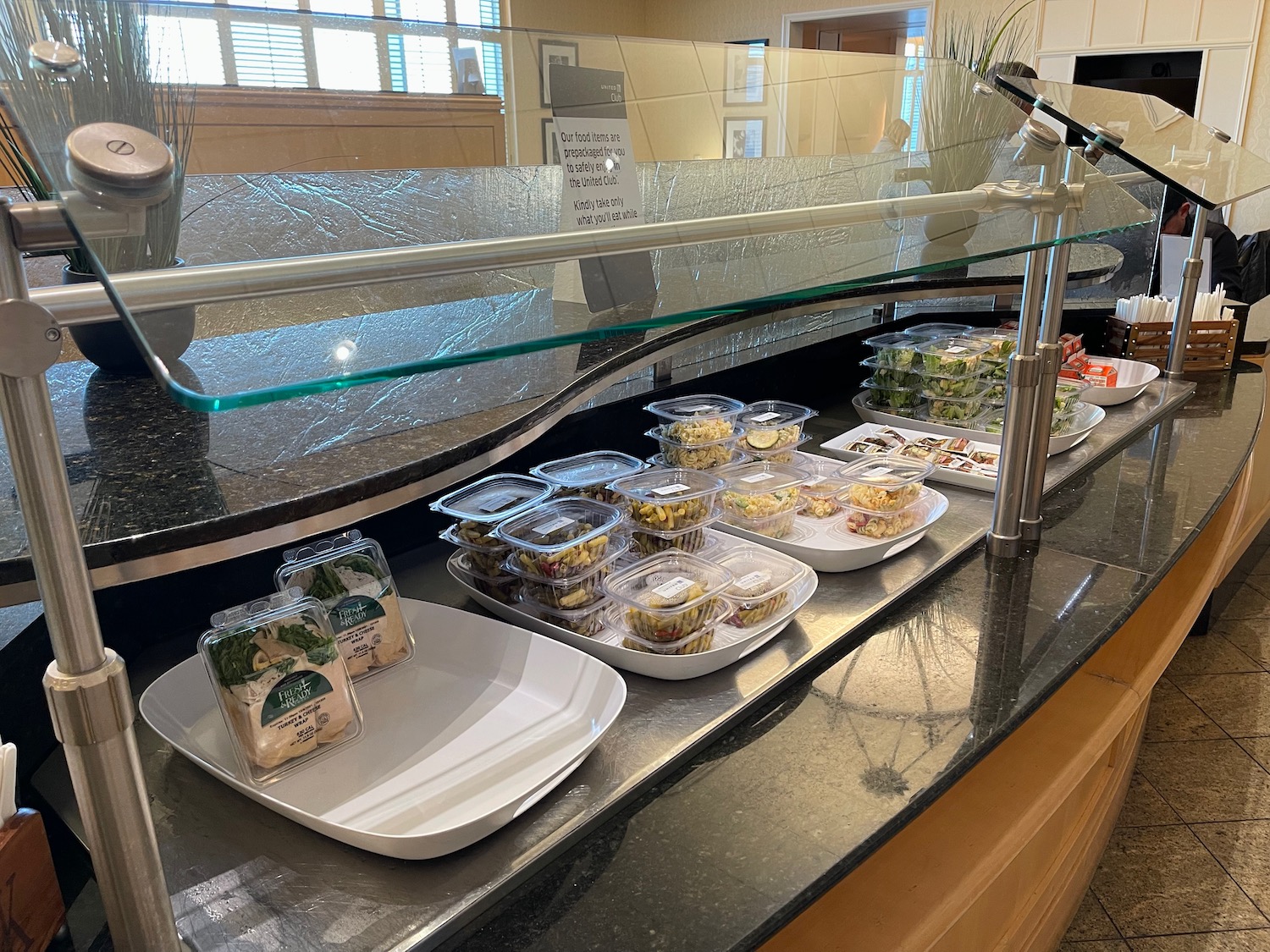 a counter with food in plastic containers