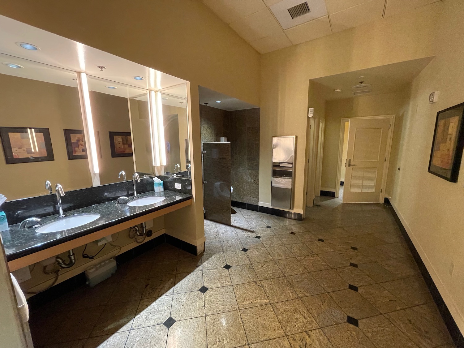 a bathroom with sinks and mirrors