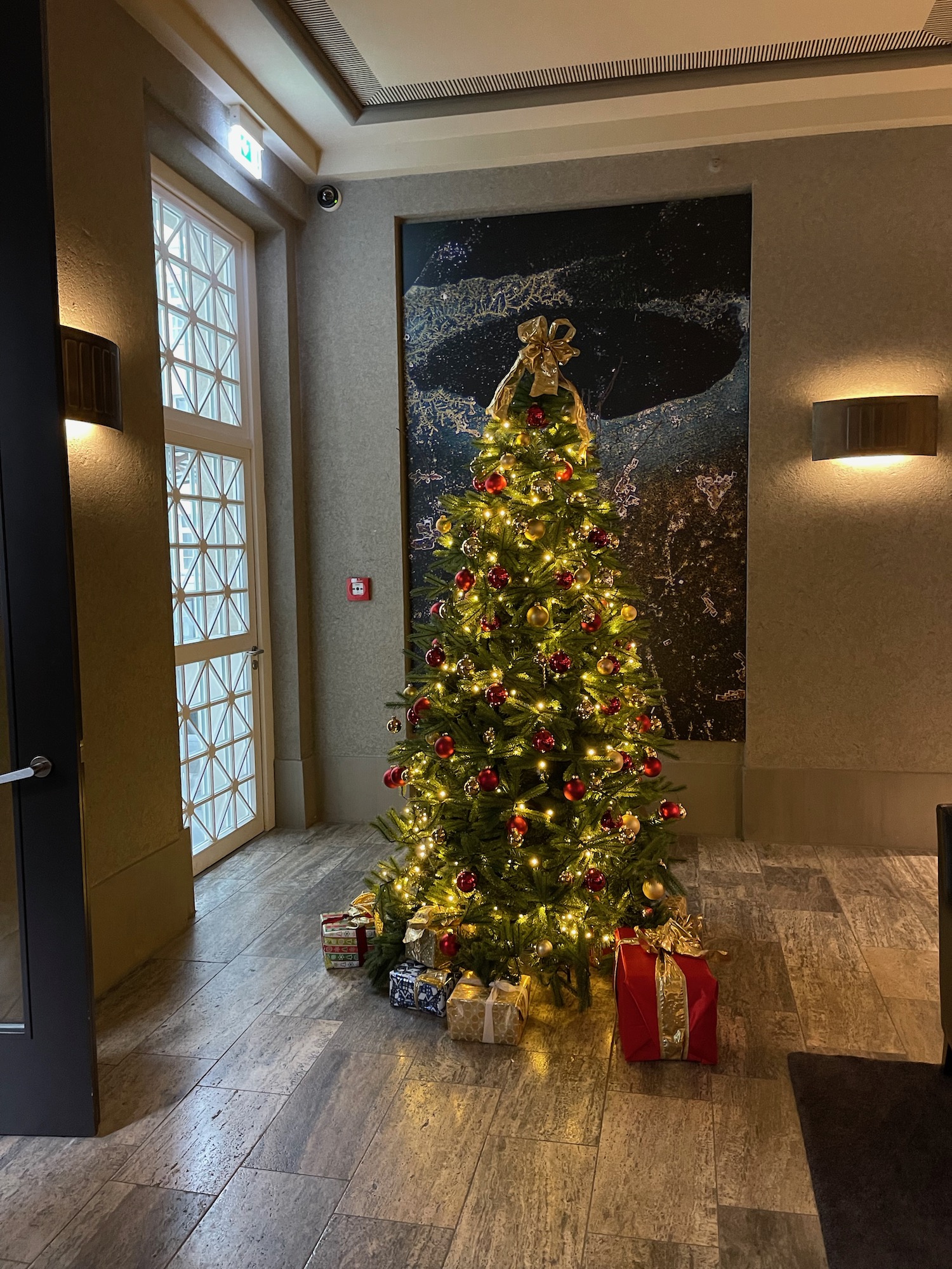 a christmas tree with lights and presents