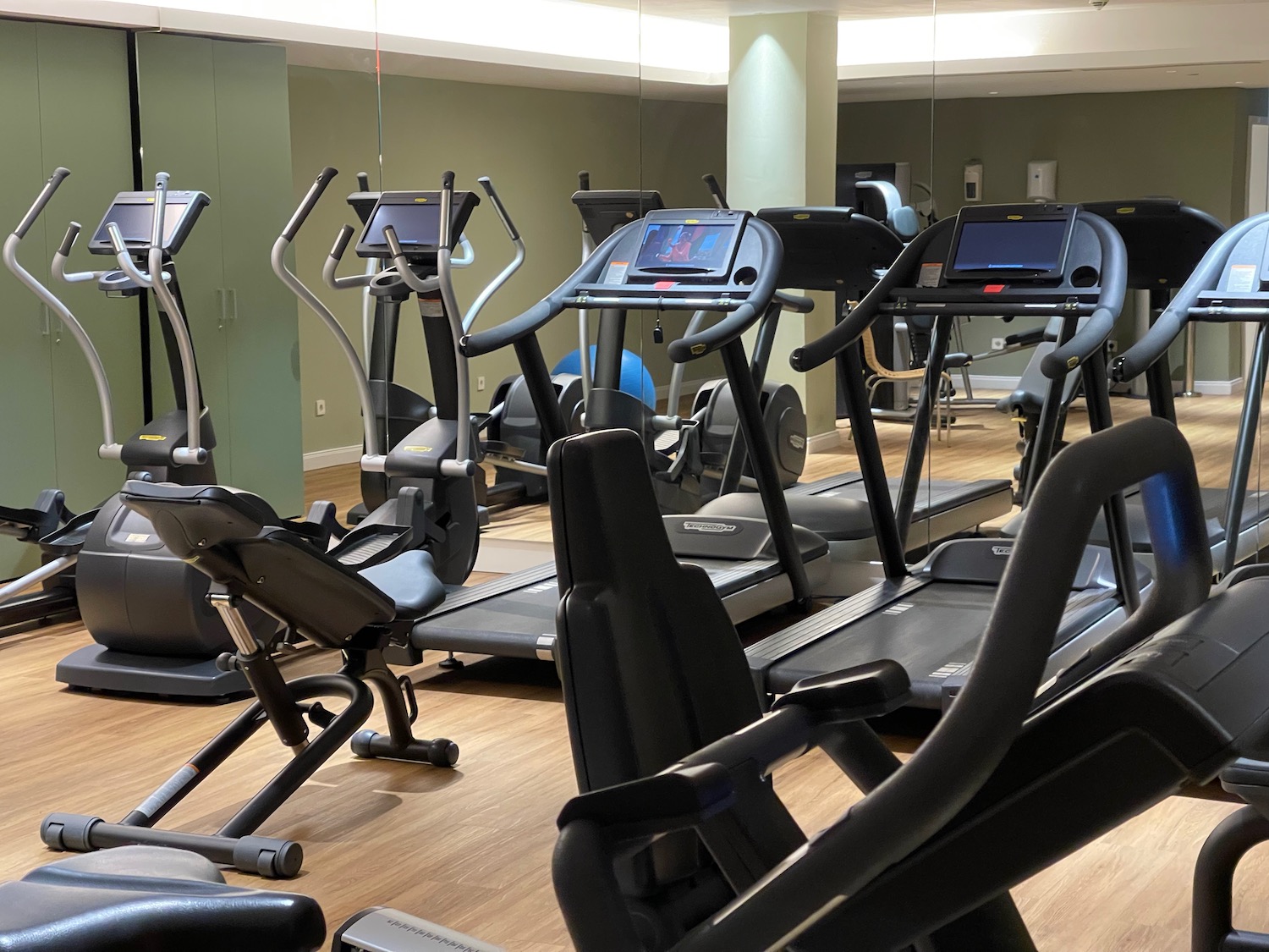 a group of treadmills in a gym