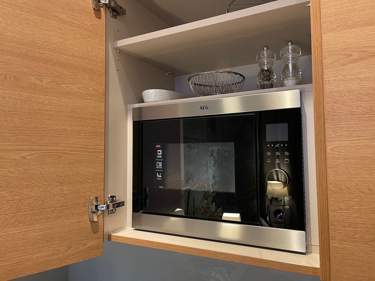 a microwave in a cabinet