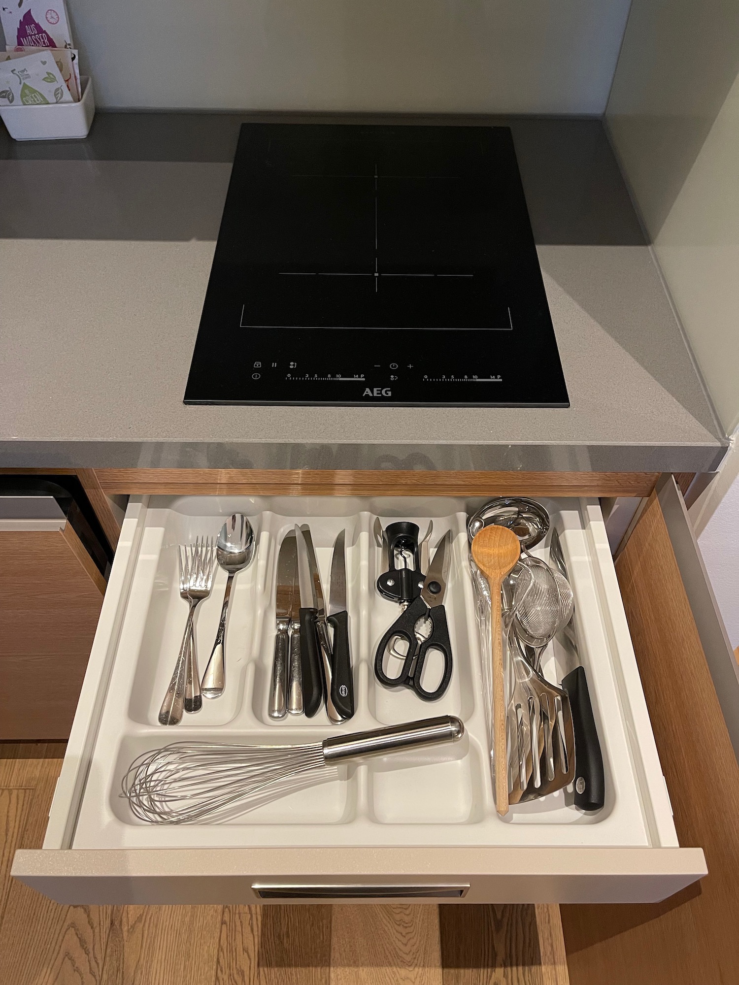 a drawer with utensils in it