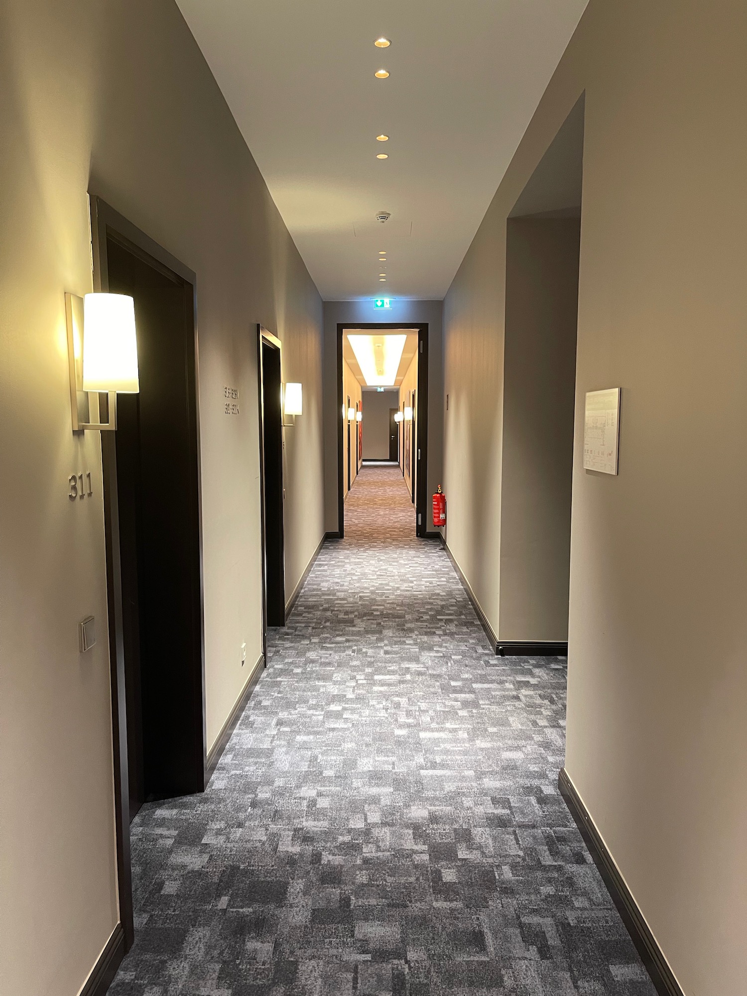 a hallway with light on the wall