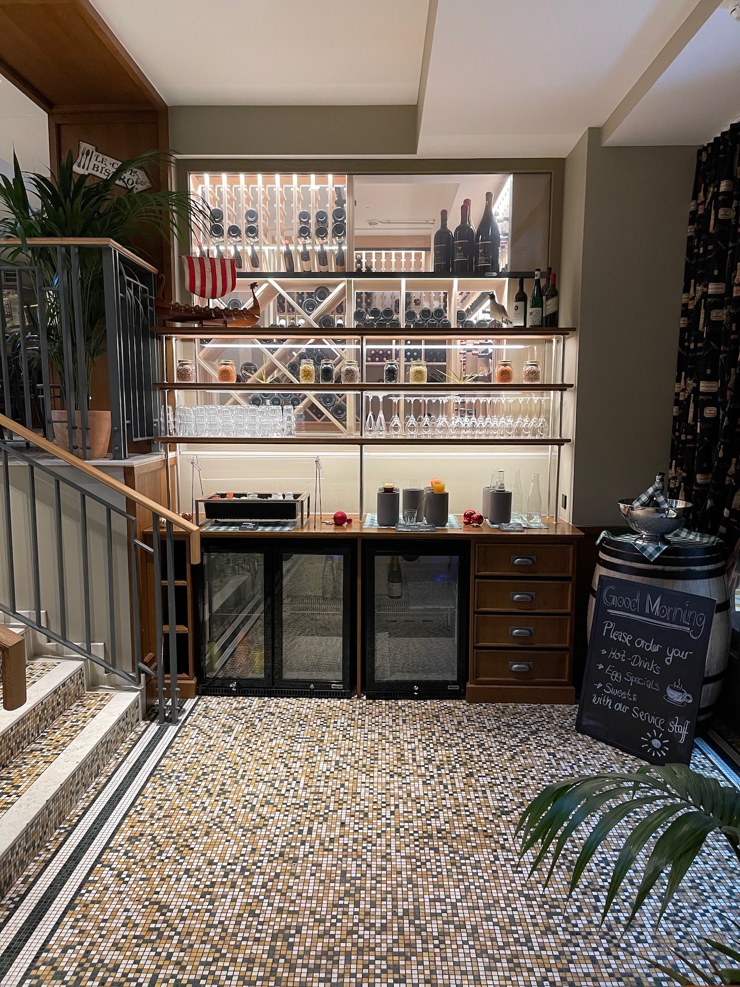 a bar with shelves and shelves of wine glasses