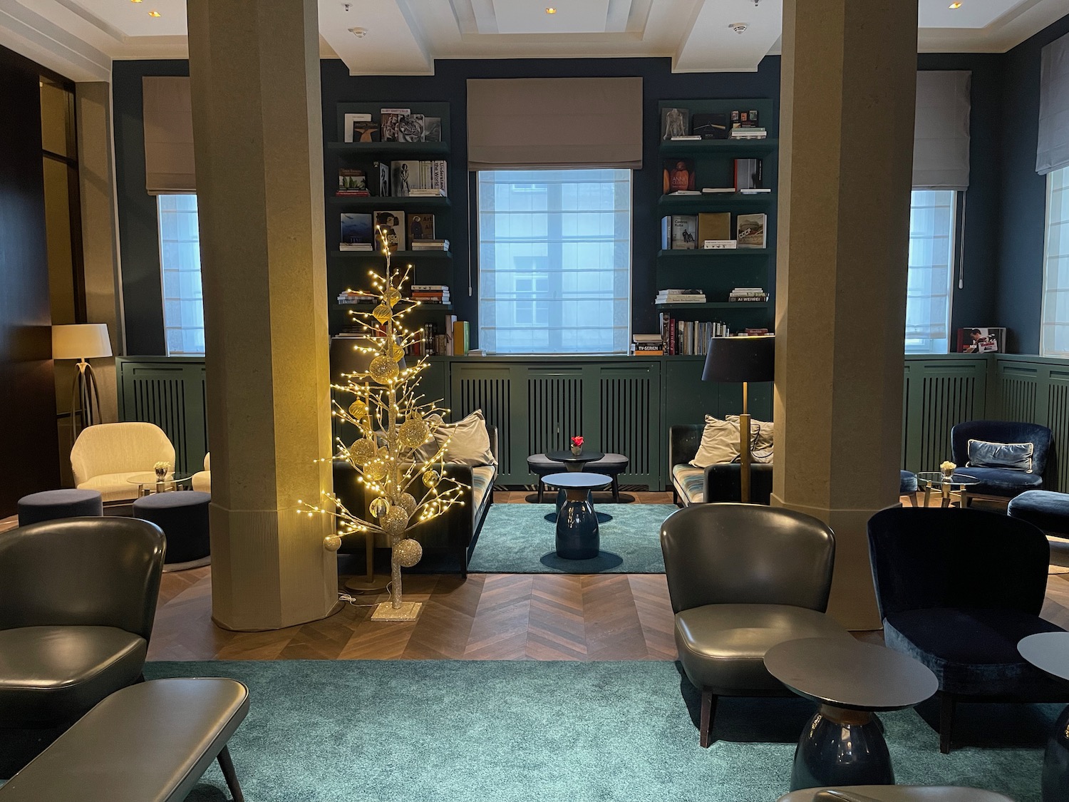 a room with a christmas tree and a coffee table