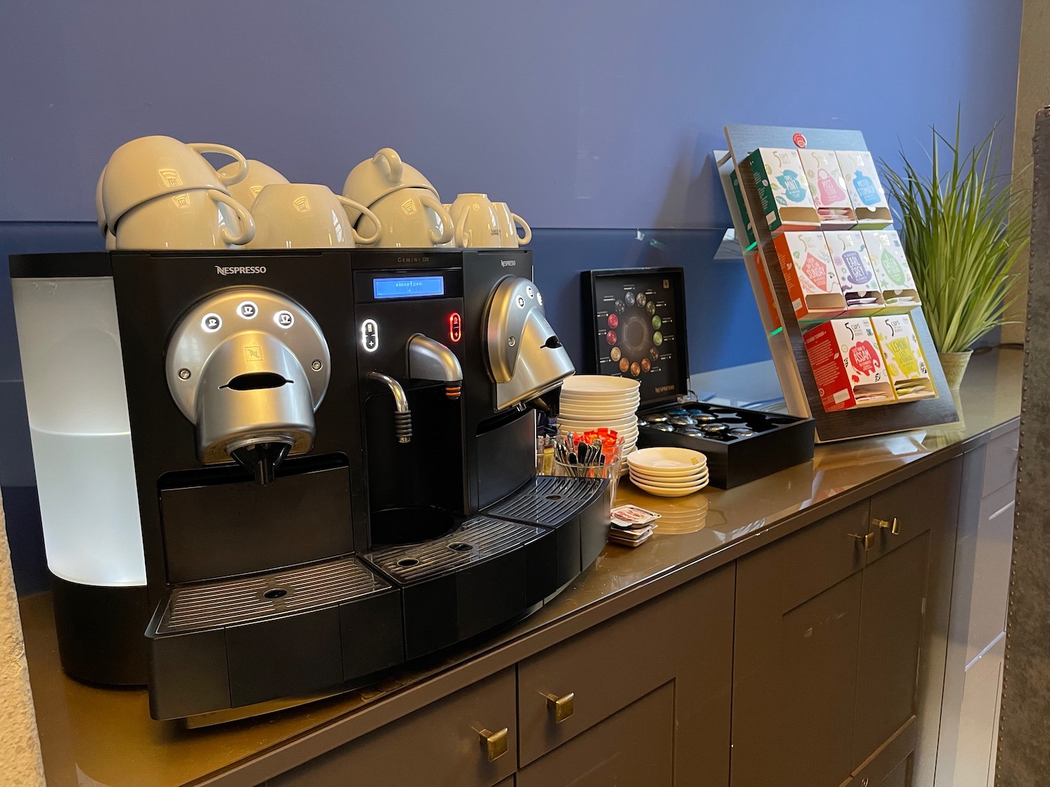 a coffee machine with cups on it