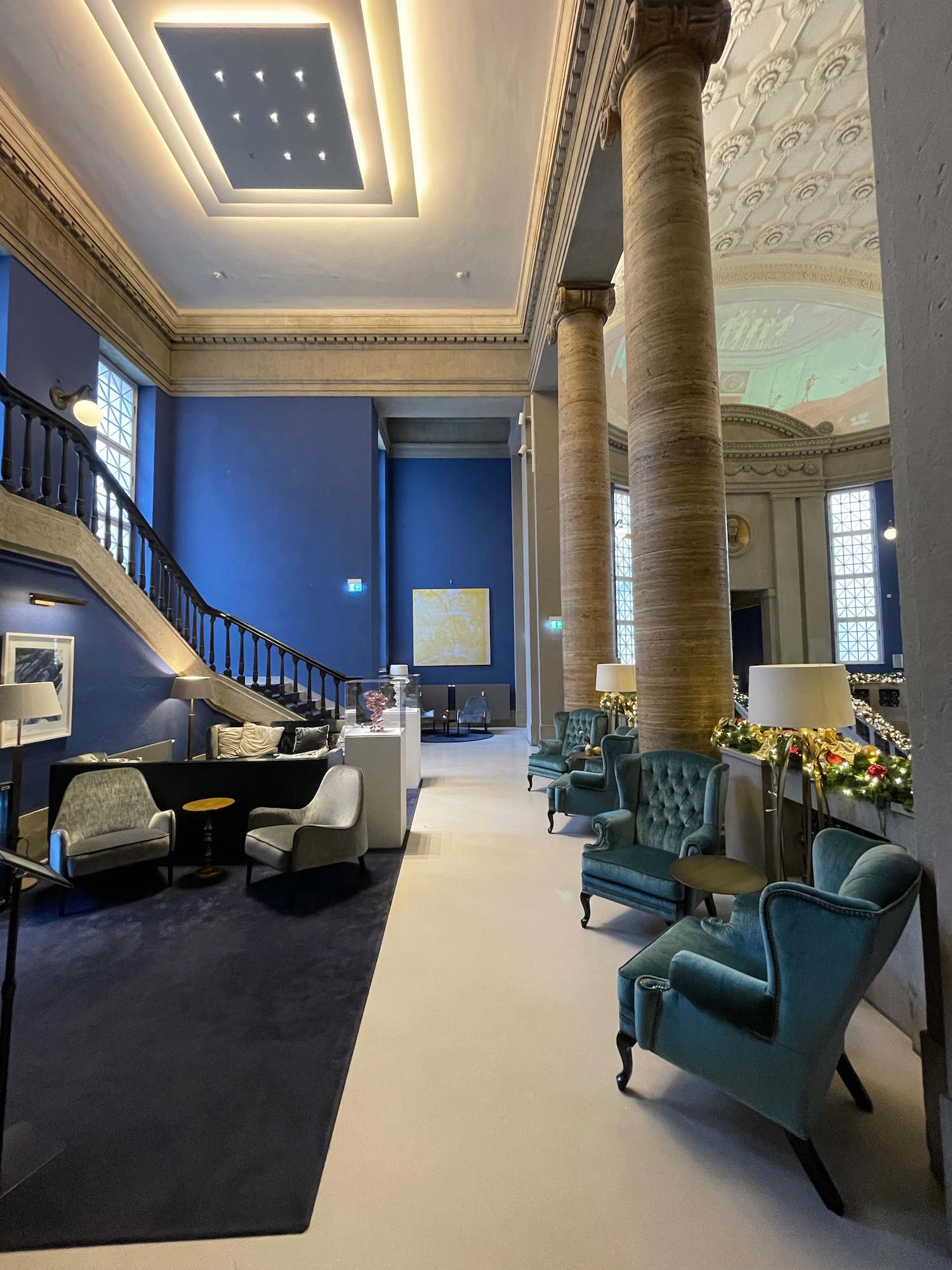 a room with blue walls and a staircase