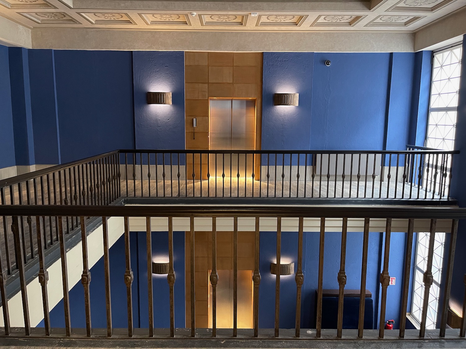 a staircase with a railing and a door