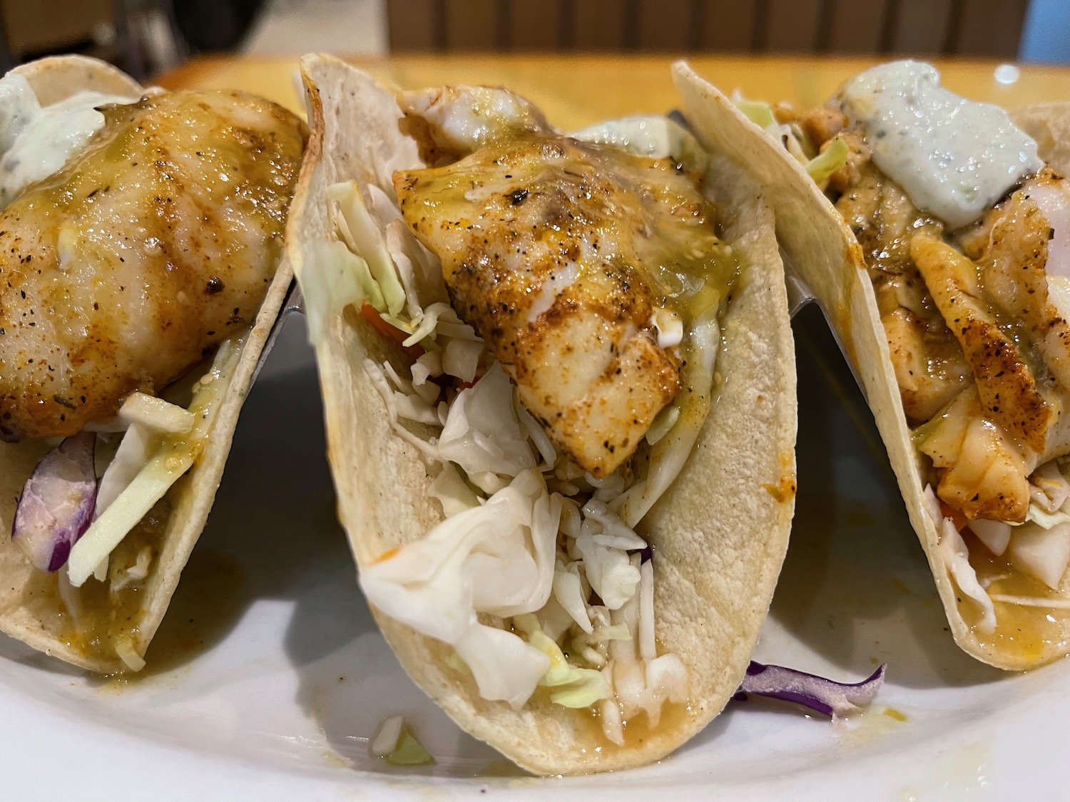a group of fish tacos on a plate