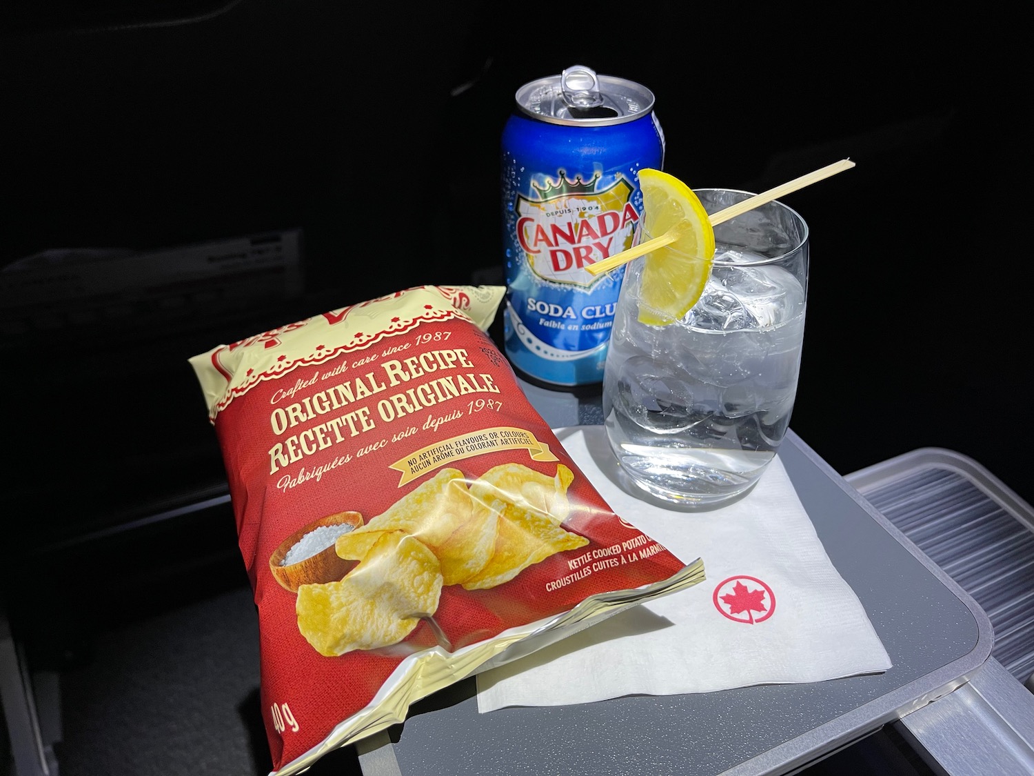 a bag of chips and a drink on a table