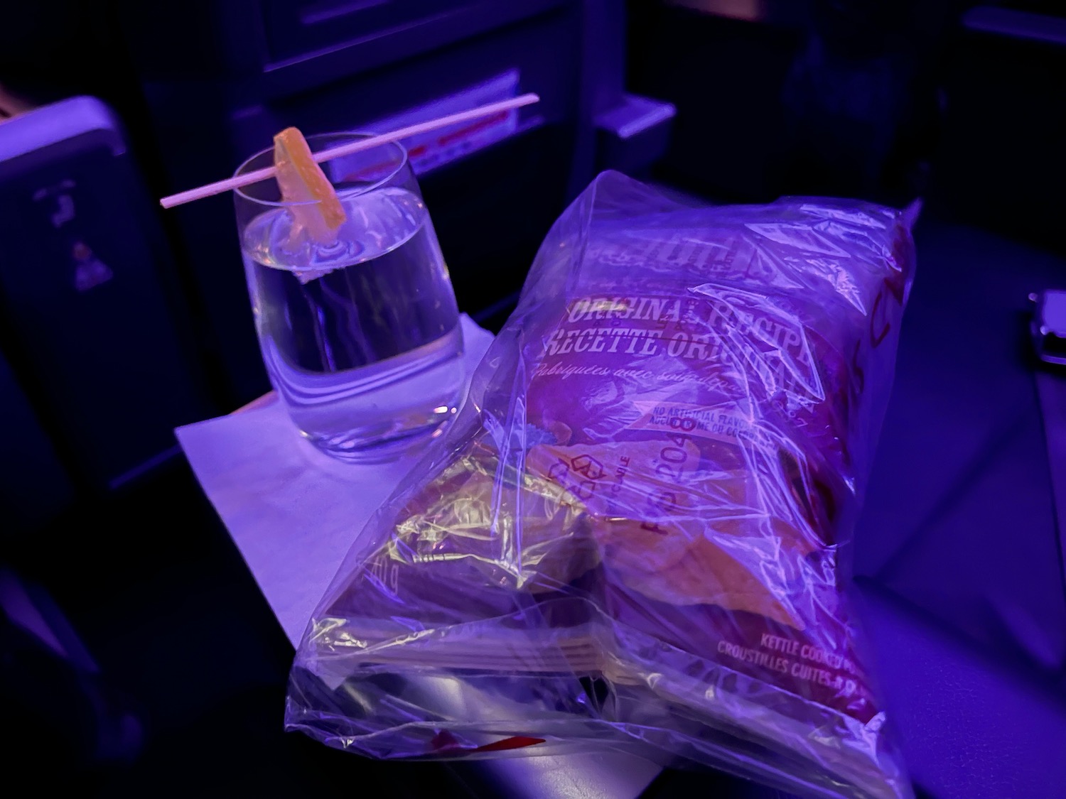a bag of food and a glass of water