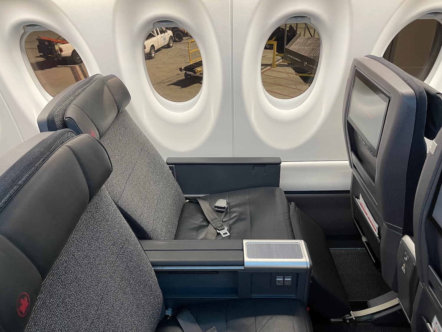 the inside of an airplane with windows and seats