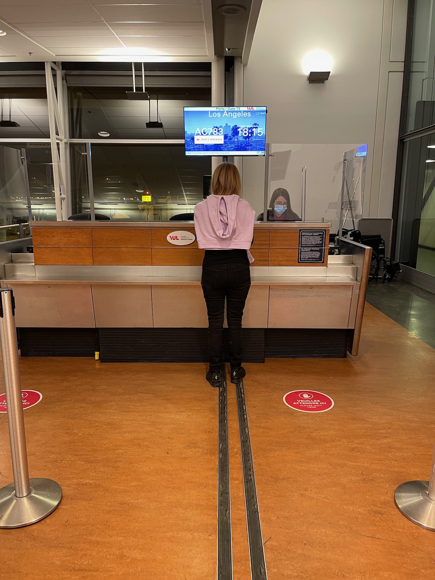 a woman standing at a counter