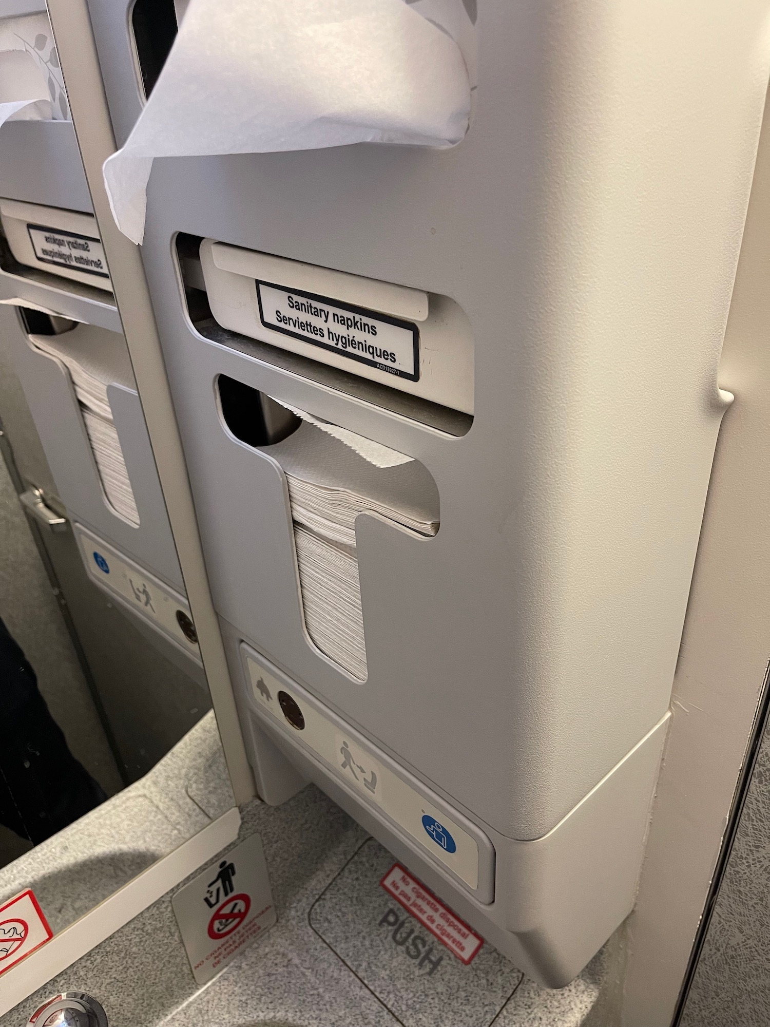 a toilet paper dispenser on a plane
