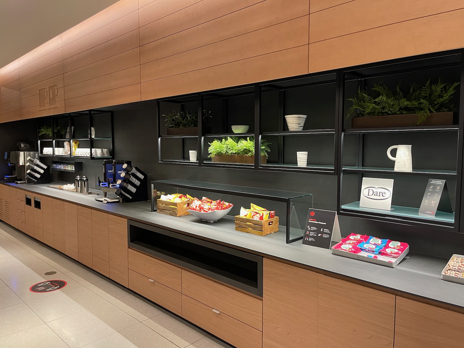 a counter with shelves and food on it