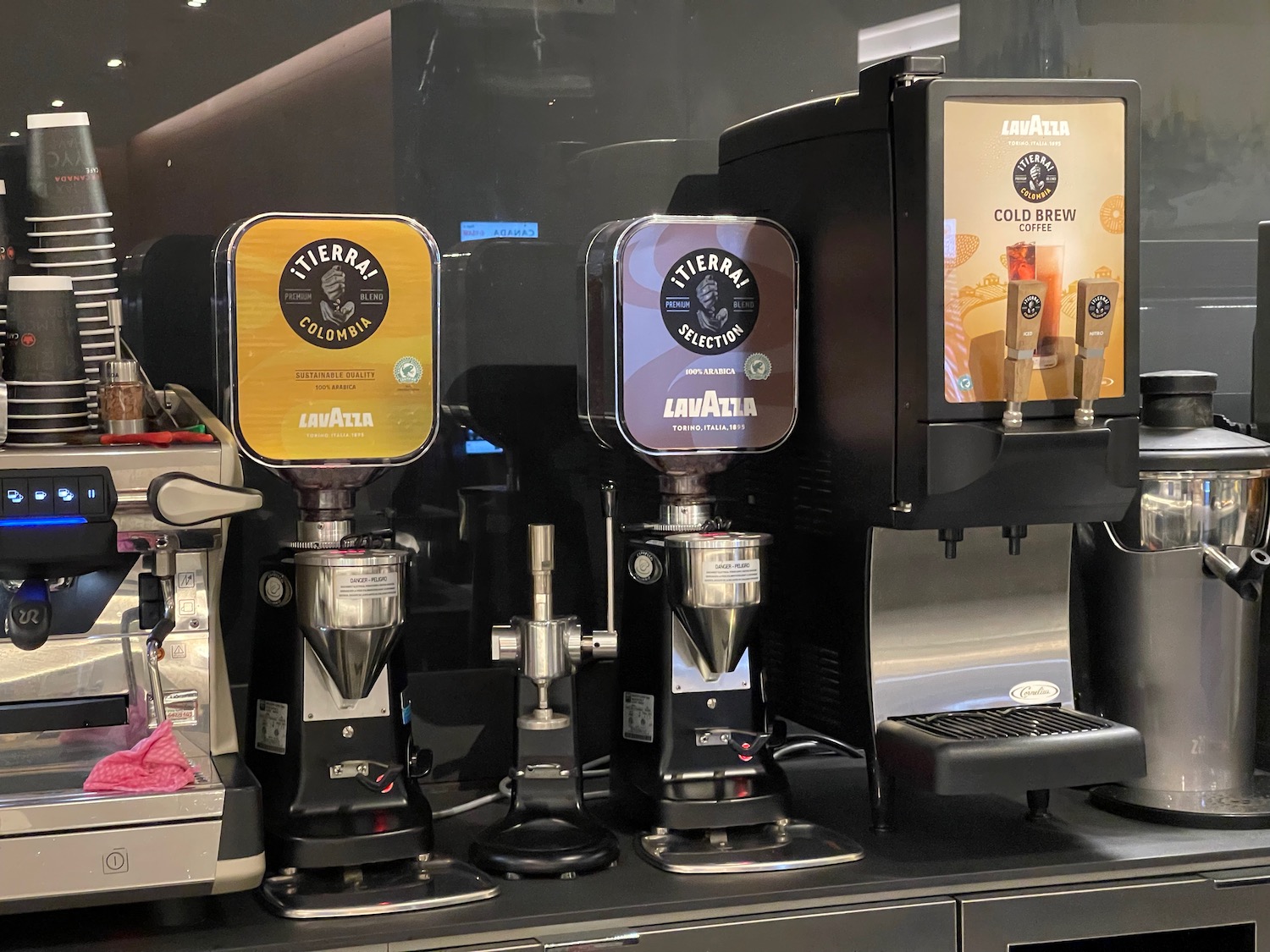 a group of coffee machines on a shelf