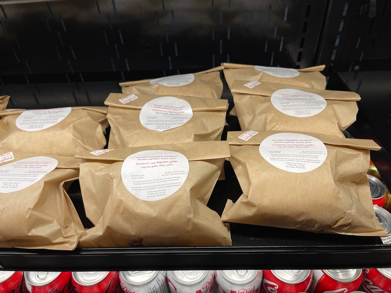 a group of brown bags with white labels on them