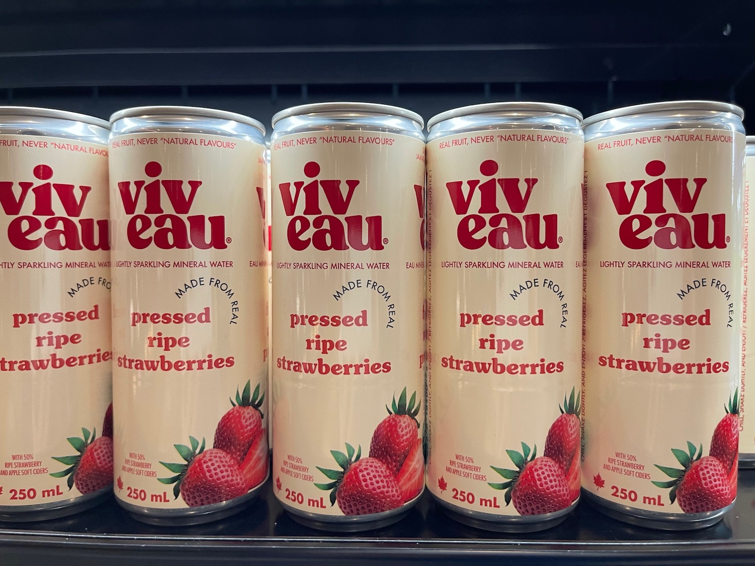 a group of cans of strawberries