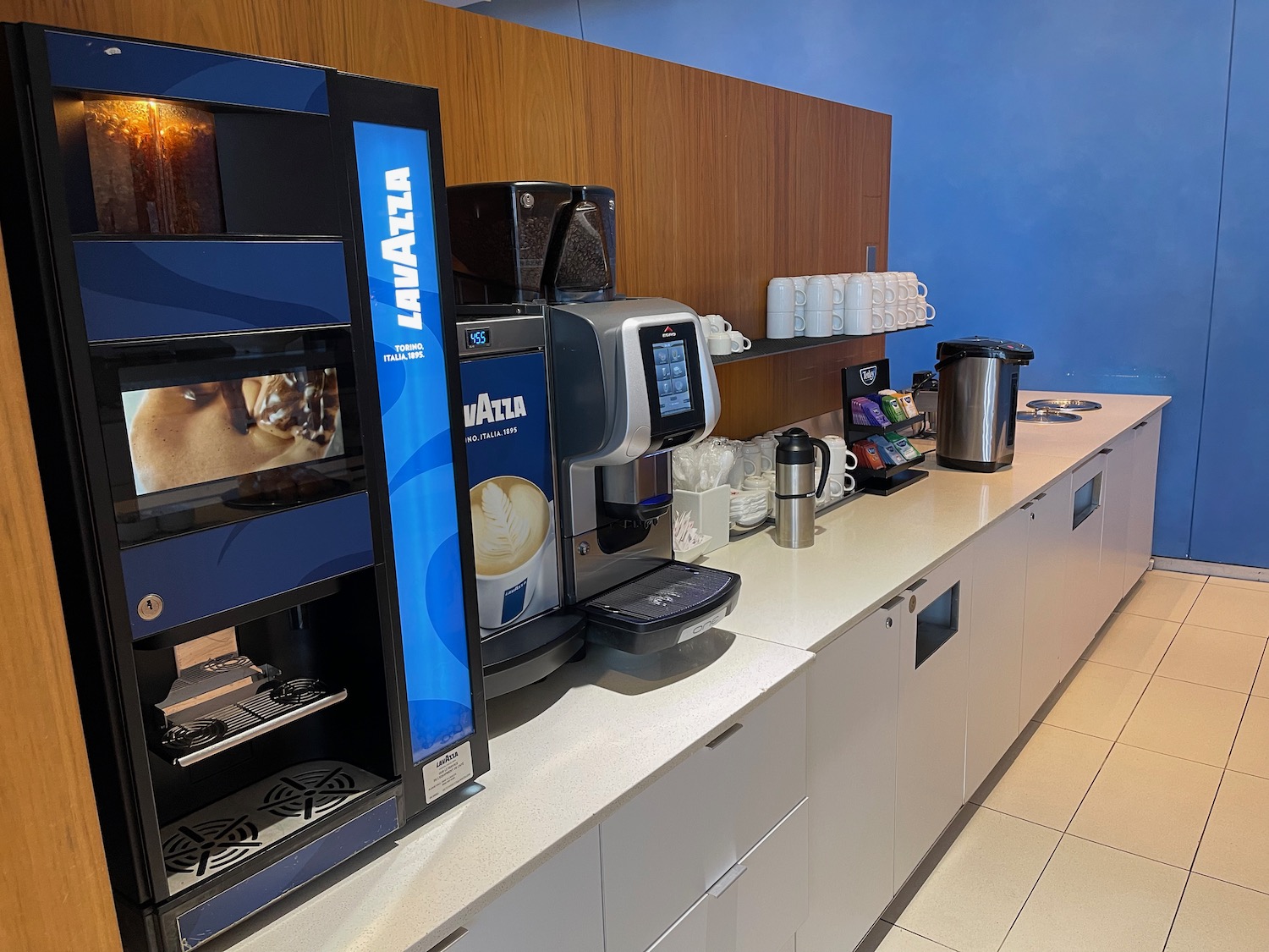 a coffee machine and coffee maker on a counter