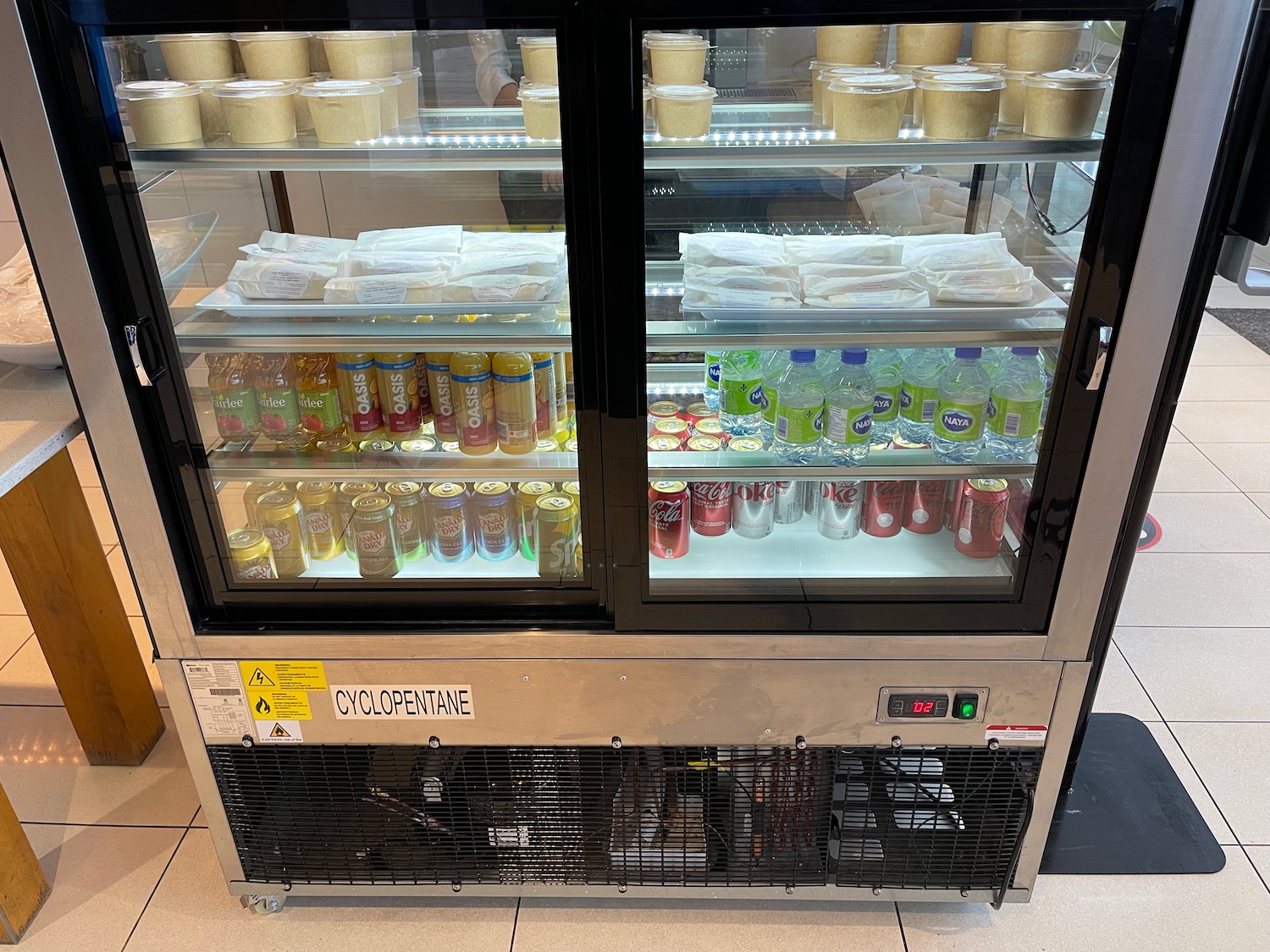 a refrigerator with drinks and beverages