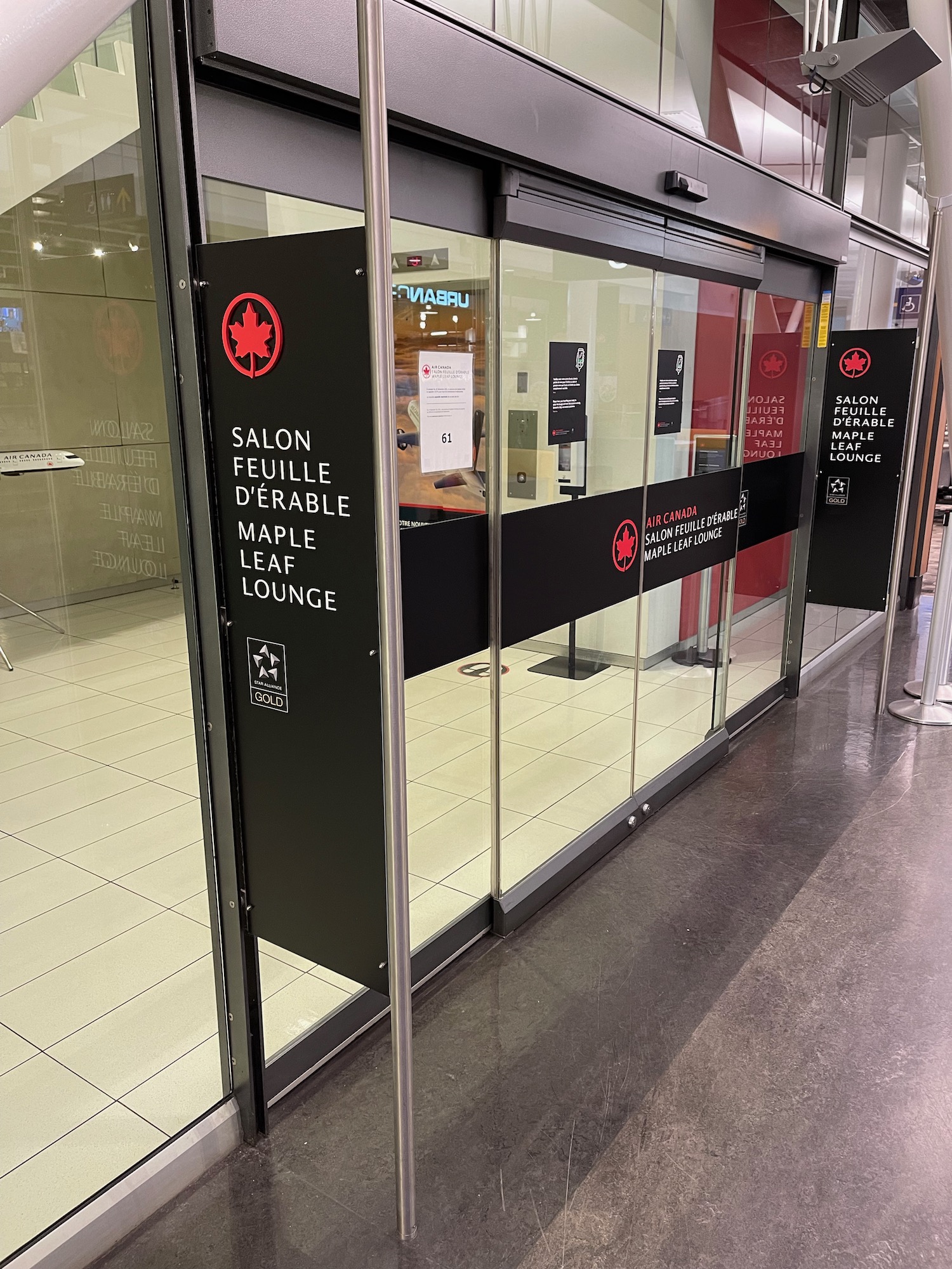 a glass door with black signs