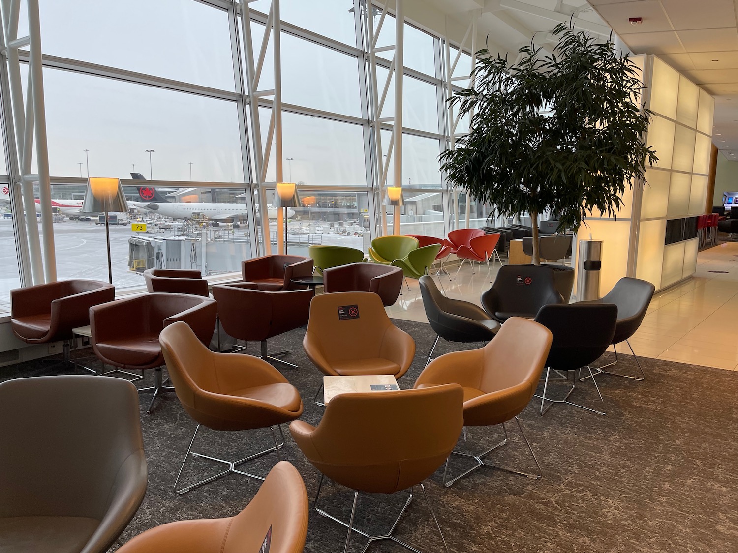 a group of chairs in a room with windows