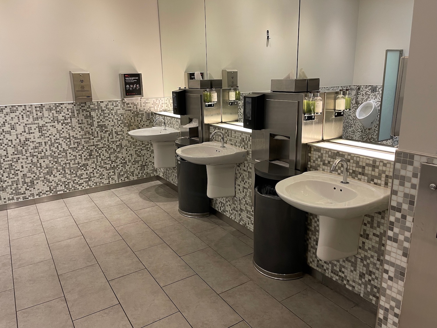 a bathroom with sinks and mirrors