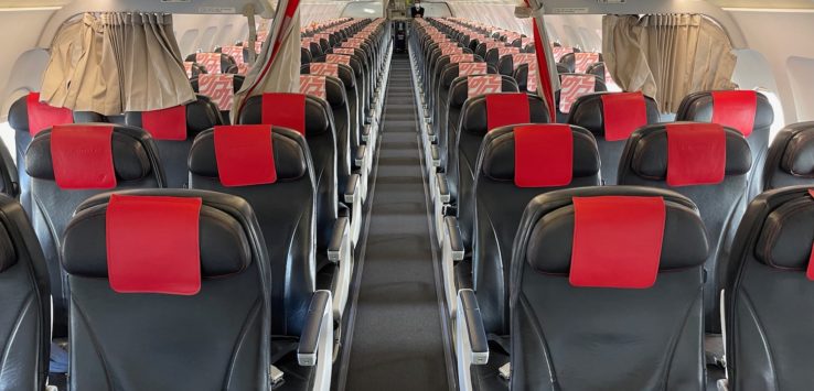 inside an airplane with rows of seats