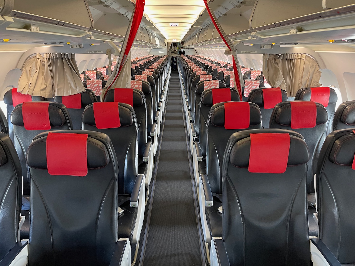 inside an airplane with rows of seats