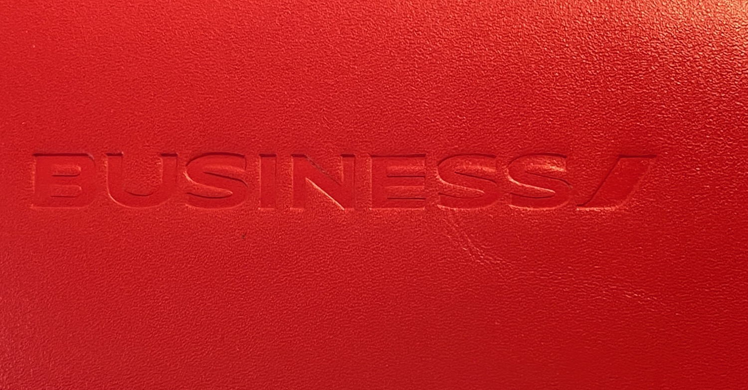 a red leather surface with text