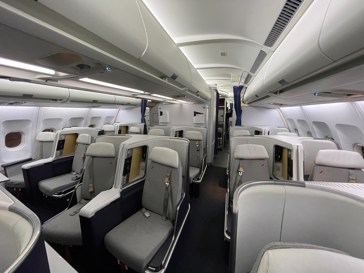 a plane with seats and ceiling lights