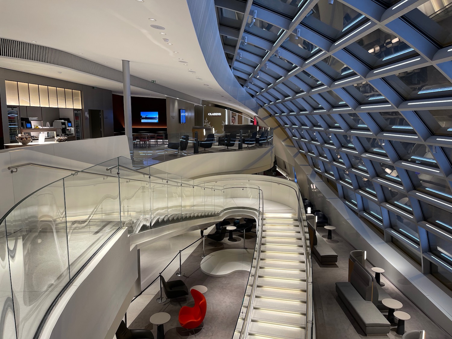 a large building with a glass ceiling and a staircase