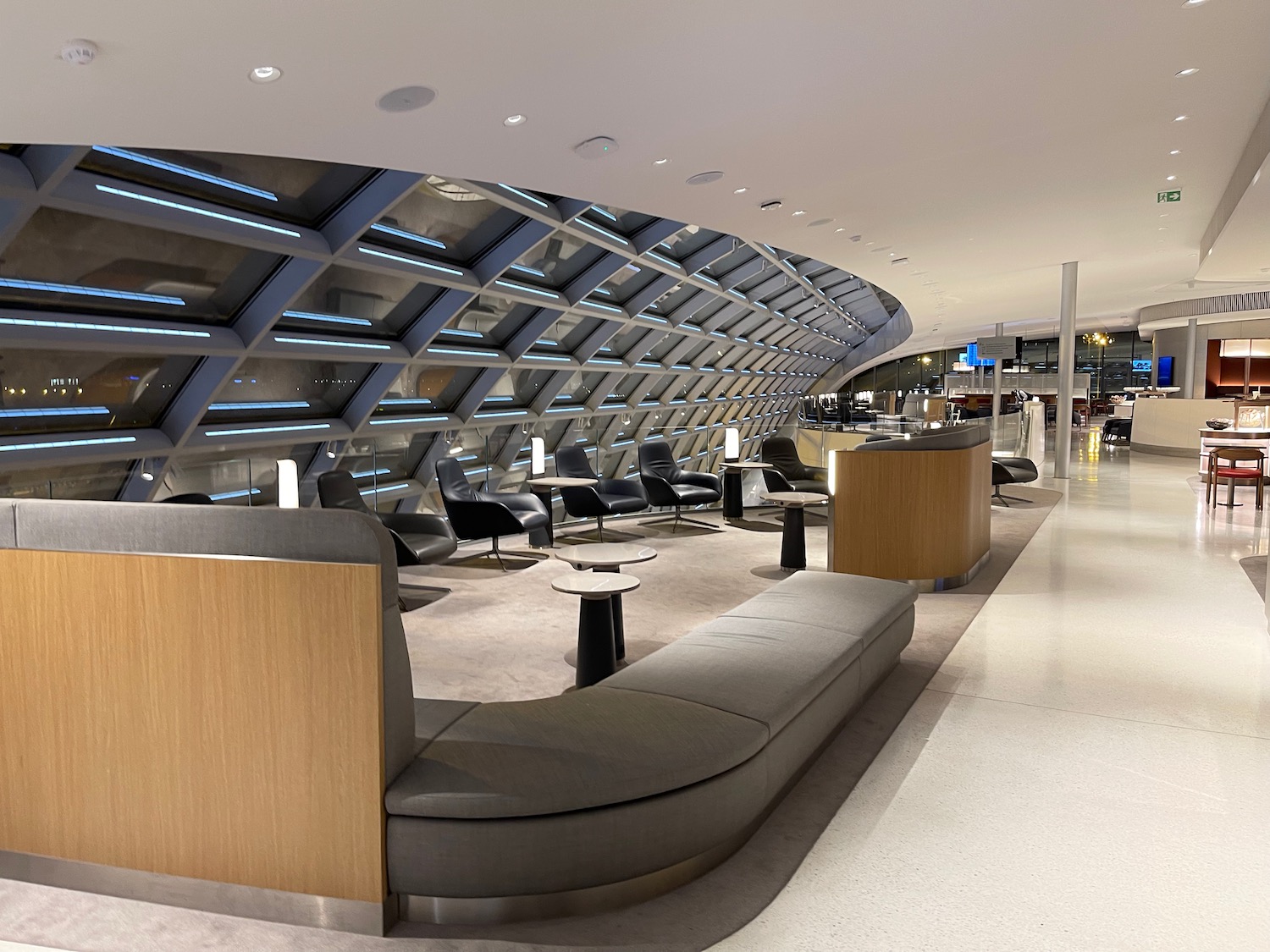 a lounge area with a curved ceiling