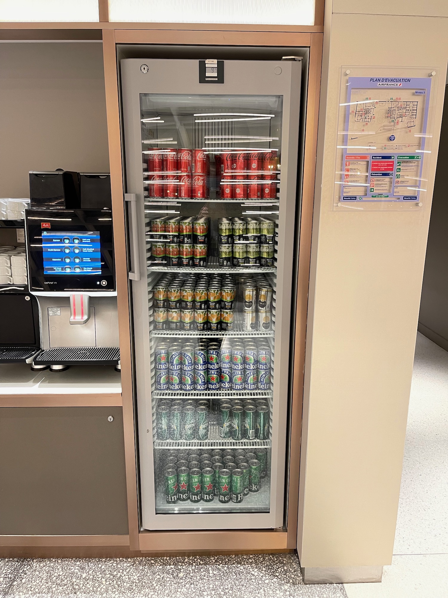 a refrigerator with cans of soda