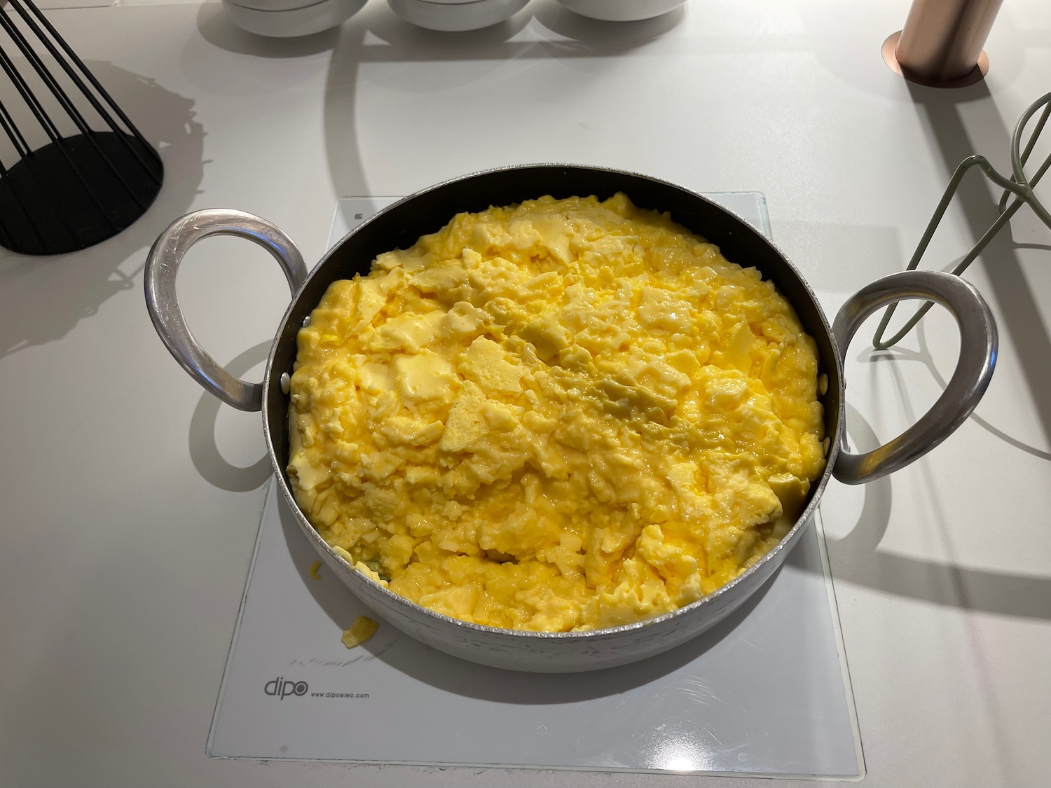 a pan of scrambled eggs