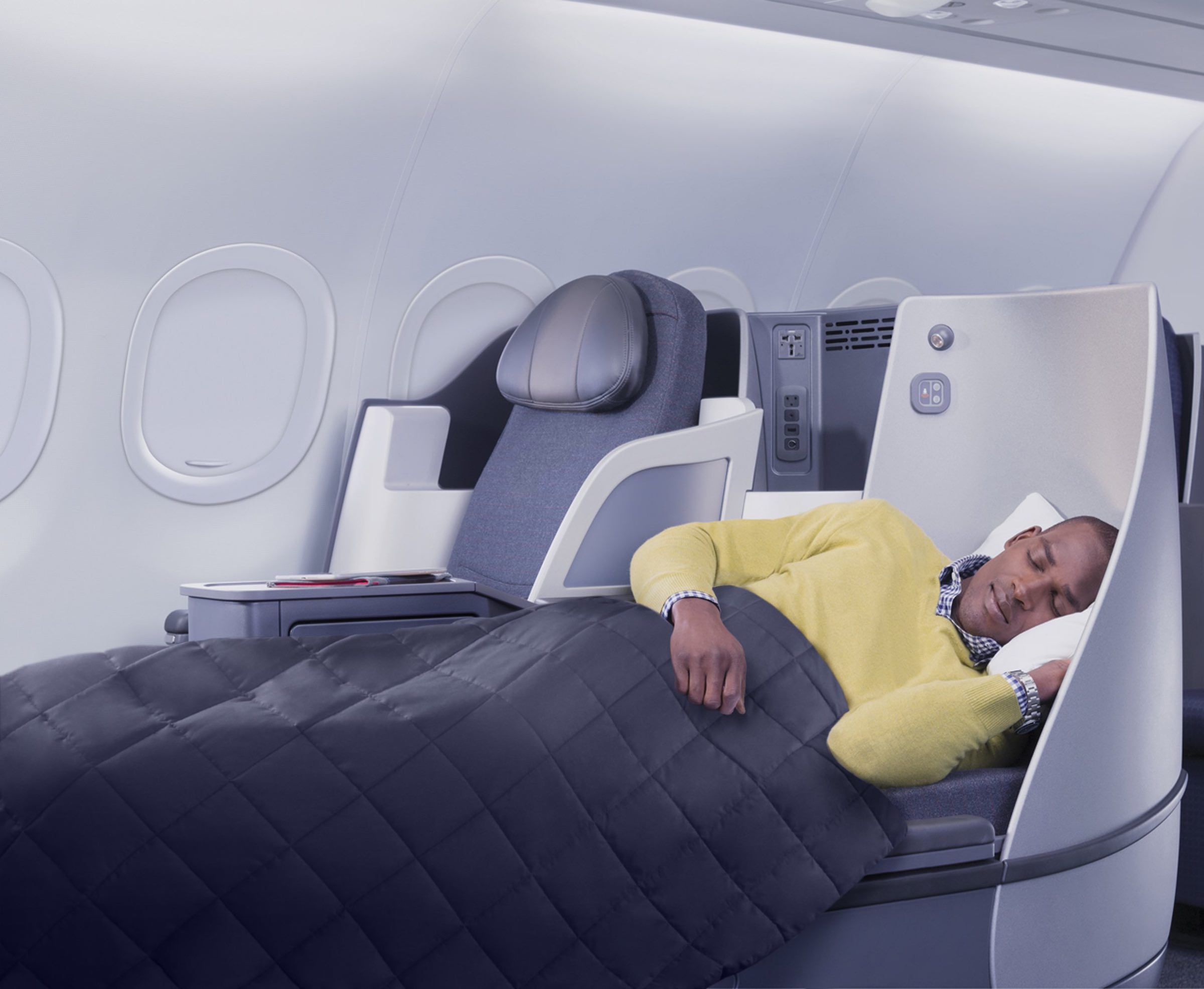 a man sleeping in a plane