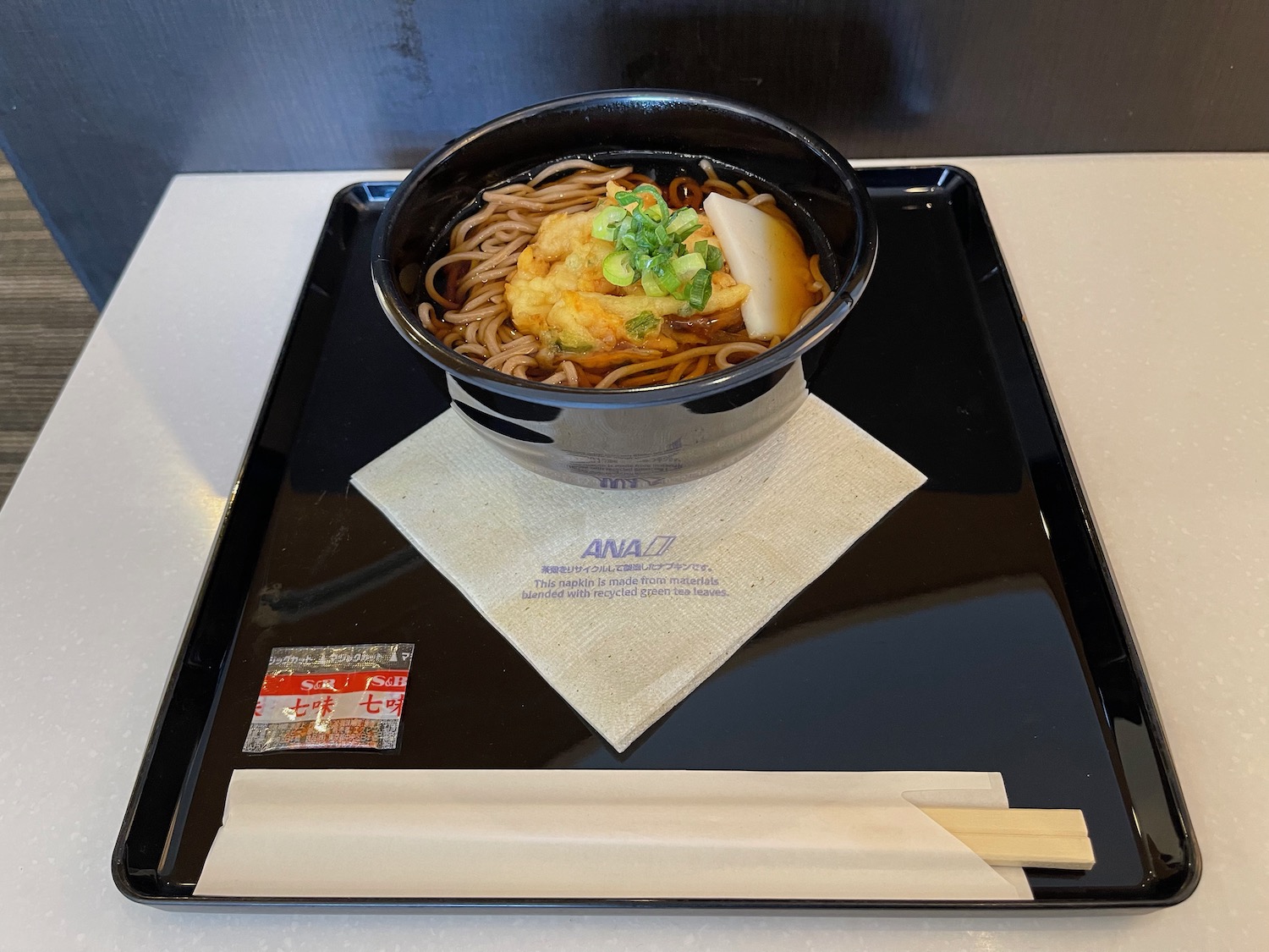 a bowl of noodles on a tray