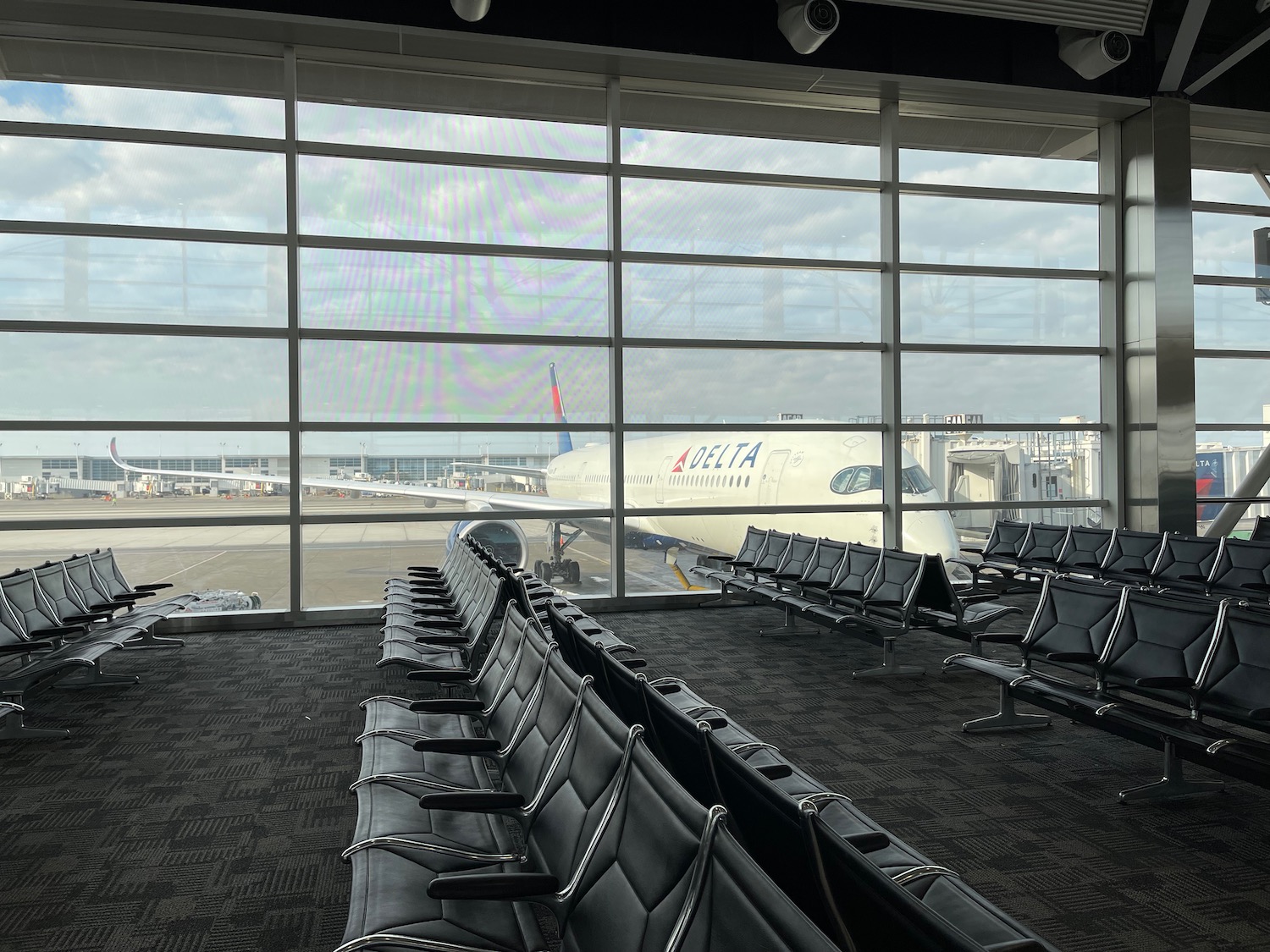 a row of chairs in an airport terminal