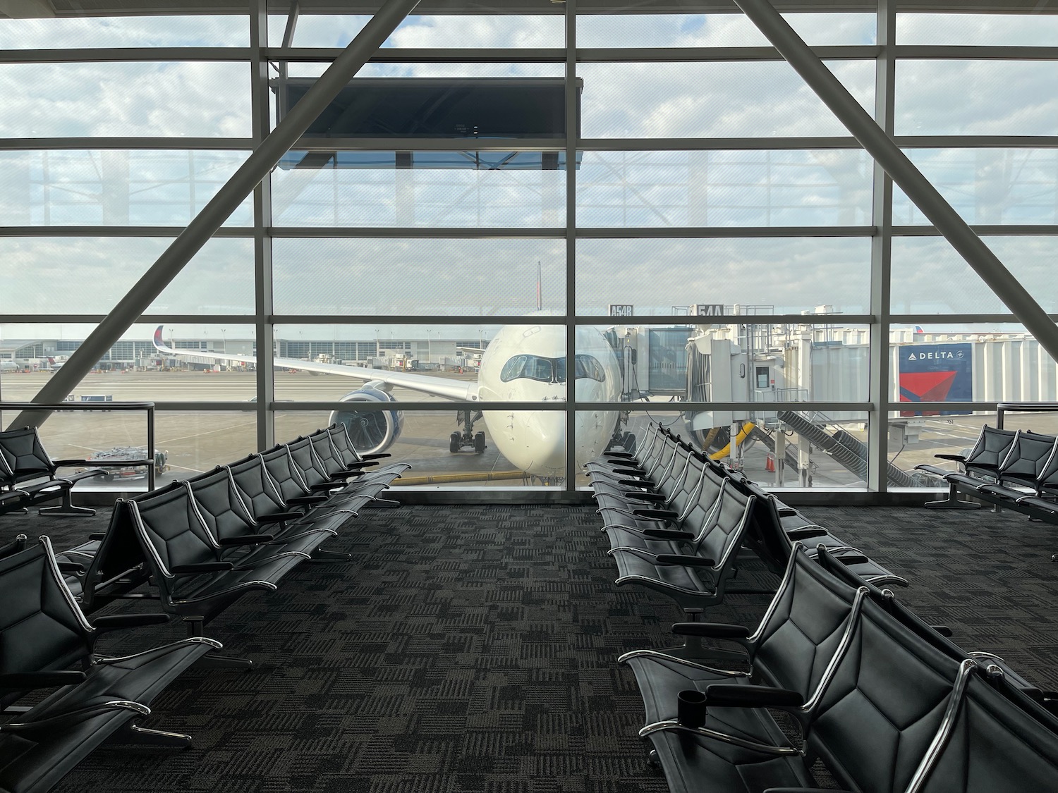 a row of chairs in an airport terminal