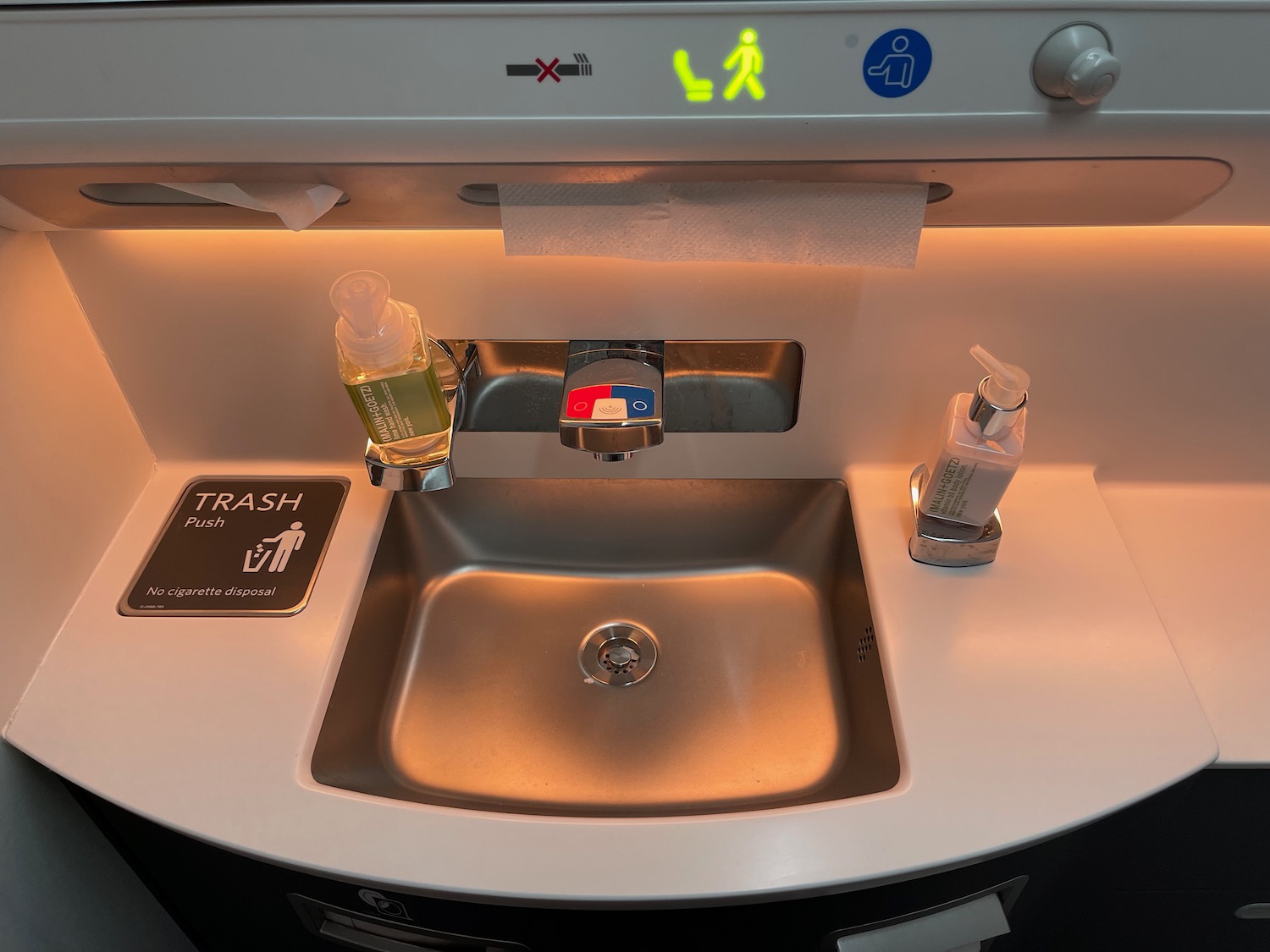 a sink with soap and hand sanitizer